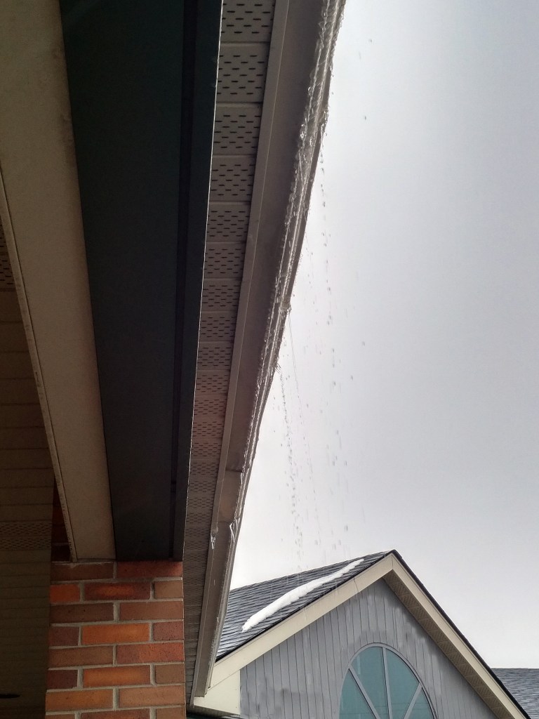 rain dripping from an eaves trough