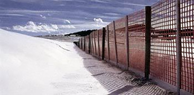 snow fence placed by roads.